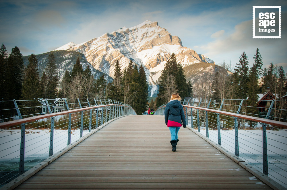 Anne Marie walking across The Bow River, Banff